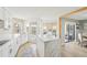 Modern kitchen features a marble island, new appliances, and natural light at 1365 Sussex Rd, Venice, FL 34293