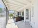Inviting screened patio featuring comfortable seating and views of the meticulously landscaped backyard at 1365 Sussex Rd, Venice, FL 34293