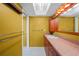 Bathroom featuring a sink with wooden vanity, a large mirror and a bright color scheme at 1386 Dewitt St, Port Charlotte, FL 33952