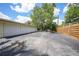 Three car garage with a large parking area and extra storage at 1386 Dewitt St, Port Charlotte, FL 33952