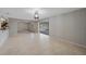 Open-concept living room with tile flooring and access to the patio/pool area at 1386 Dewitt St, Port Charlotte, FL 33952