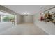 Bright and airy living room with open access to patio, creating seamless indoor-outdoor flow at 1386 Dewitt St, Port Charlotte, FL 33952
