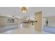 Open-concept living and kitchen area with tile floors and lots of light at 1386 Dewitt St, Port Charlotte, FL 33952
