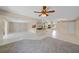 Bright open-concept living space with tile flooring leading to the kitchen at 1386 Dewitt St, Port Charlotte, FL 33952