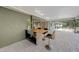 Outdoor bar area complete with sink, stools, and views of the pool and patio at 1386 Dewitt St, Port Charlotte, FL 33952