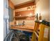 Organized workshop area with pegboard wall, workbench, and ample storage space at 1386 Dewitt St, Port Charlotte, FL 33952