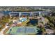Aerial view of community amenities, including a pool, tennis court, and waterfront access at 1401 S Mccall Rd # A 108, Englewood, FL 34223
