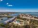 An aerial view of the community showing proximity to the bay, pool, and tennis court at 1401 S Mccall Rd # A 108, Englewood, FL 34223