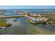 This aerial view shows the waterfront condo community near the bay with stunning views and boat docks at 1401 S Mccall Rd # A 108, Englewood, FL 34223