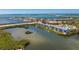 Aerial view of the condo community with waterfront access and a beautiful bay backdrop at 1401 S Mccall Rd # A 108, Englewood, FL 34223