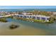 An aerial view showcasing the condo community's waterfront location and boat docks at 1401 S Mccall Rd # A 108, Englewood, FL 34223
