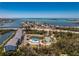 Stunning aerial view of waterfront community with pool, tennis court, and beautiful bay views at 1401 S Mccall Rd # A 108, Englewood, FL 34223