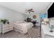 Comfortable bedroom with a ceiling fan, desk area, and a window with a view of the community at 1401 S Mccall Rd # A 108, Englewood, FL 34223