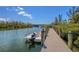 Dock featuring boat and views of the channel at 1401 S Mccall Rd # A 108, Englewood, FL 34223