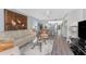 Cozy living room with a blend of decor, comfortable seating, and a glimpse into the open kitchen at 1401 S Mccall Rd # A 108, Englewood, FL 34223