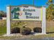 Lemon Bay Breezes community sign featuring palm tree graphic and pleasant landscaping at 1401 S Mccall Rd # A 108, Englewood, FL 34223