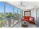 Relaxing sunroom with large windows, ceiling fan and outdoor views at 1401 S Mccall Rd # A 108, Englewood, FL 34223