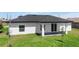 An inviting backyard with a covered patio is ideal for relaxing or entertaining guests outdoors at 166 Bunker Rd, Rotonda West, FL 33947
