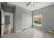 Bedroom with a view, double door closet, and wood-look tile floors at 166 Bunker Rd, Rotonda West, FL 33947