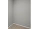 Walk-in closet area showcasing neutral paint and tiled flooring at 166 Bunker Rd, Rotonda West, FL 33947