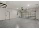 Garage featuring a newly painted floor and insulated garage door at 166 Bunker Rd, Rotonda West, FL 33947