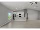 Bright kitchen boasts white cabinets, stainless appliances, and a kitchen island perfect for entertaining at 166 Bunker Rd, Rotonda West, FL 33947
