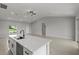 Bright open-concept kitchen with large island and sink, stainless steel dishwasher, and modern finishes at 166 Bunker Rd, Rotonda West, FL 33947