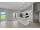 Modern kitchen with white cabinets, stainless steel appliances, and a center island, perfect for cooking at 166 Bunker Rd, Rotonda West, FL 33947