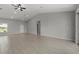 Spacious living room with tile flooring, high ceilings, and an abundance of natural light at 166 Bunker Rd, Rotonda West, FL 33947
