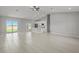 Open concept living room and kitchen with vaulted ceilings, recessed lights and tile floors at 166 Bunker Rd, Rotonda West, FL 33947