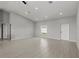 Bright living room with neutral paint colors, vaulted ceilings, recessed lights, and tile floors at 166 Bunker Rd, Rotonda West, FL 33947