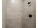 Modern bathroom with tiled walk-in shower featuring sleek fixtures and neutral tones at 166 Bunker Rd, Rotonda West, FL 33947