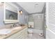 Bathroom featuring a glass shower door, ceramic tile flooring, and modern vanity at 1670 Faust Dr, Englewood, FL 34224
