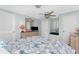 Bright bedroom featuring plantation shutters and built-in window seating at 1670 Faust Dr, Englewood, FL 34224