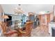 Open dining area with wicker seating adjacent to the living room and kitchen, creating a welcoming space at 1670 Faust Dr, Englewood, FL 34224