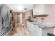 Updated kitchen featuring stainless steel appliances, granite countertops, and ample cabinet space at 1670 Faust Dr, Englewood, FL 34224