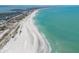 Wide aerial view of the coast showing the beach, coastline, and surrounding community at 17 Seawatch Dr, Boca Grande, FL 33921