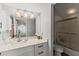Compact bathroom featuring a single sink, a vanity with white cabinets, and a glass-enclosed shower at 17 Seawatch Dr, Boca Grande, FL 33921