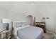 Comfortable bedroom featuring a vaulted ceiling, neutral walls, a ceiling fan, and simple decor at 17 Seawatch Dr, Boca Grande, FL 33921