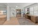 Bright home office with wood floors, built-in shelves, and a large desk near window with shutters at 17 Seawatch Dr, Boca Grande, FL 33921