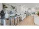 Stylish kitchen with white cabinetry, luxury countertops, and stainless steel appliances at 17 Seawatch Dr, Boca Grande, FL 33921