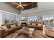 Spacious living room with fireplace, wood ceiling, comfortable seating and views at 17 Seawatch Dr, Boca Grande, FL 33921