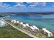 Scenic aerial view of waterfront condos by the bay, showcasing the coastal lifestyle at 1701 Beach Rd # 208, Englewood, FL 34223