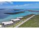 Stunning aerial view of waterfront condos, with lush landscaping and beautiful ocean views at 1701 Beach Rd # 208, Englewood, FL 34223