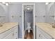 Bathroom showcasing a double vanity and an enclosed glass shower at 1701 Beach Rd # 208, Englewood, FL 34223