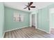 Bedroom featuring ceiling fan, modern flooring and a closet for storage at 1701 Beach Rd # 208, Englewood, FL 34223