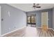 Bedroom featuring sliding glass doors to outdoor area and modern flooring at 1701 Beach Rd # 208, Englewood, FL 34223