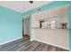 Bright living room featuring stylish flooring and an inviting breakfast bar area at 1701 Beach Rd # 208, Englewood, FL 34223