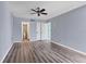 Main bedroom showcasing modern floors, a ceiling fan and an ensuite bathroom at 1701 Beach Rd # 208, Englewood, FL 34223
