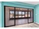 Spacious screened patio with tiled flooring, ceiling fan, and expansive views from sliding glass doors at 1701 Beach Rd # 208, Englewood, FL 34223